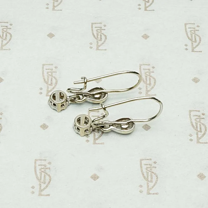 Delicate Diamond Drop Earrings in White Gold