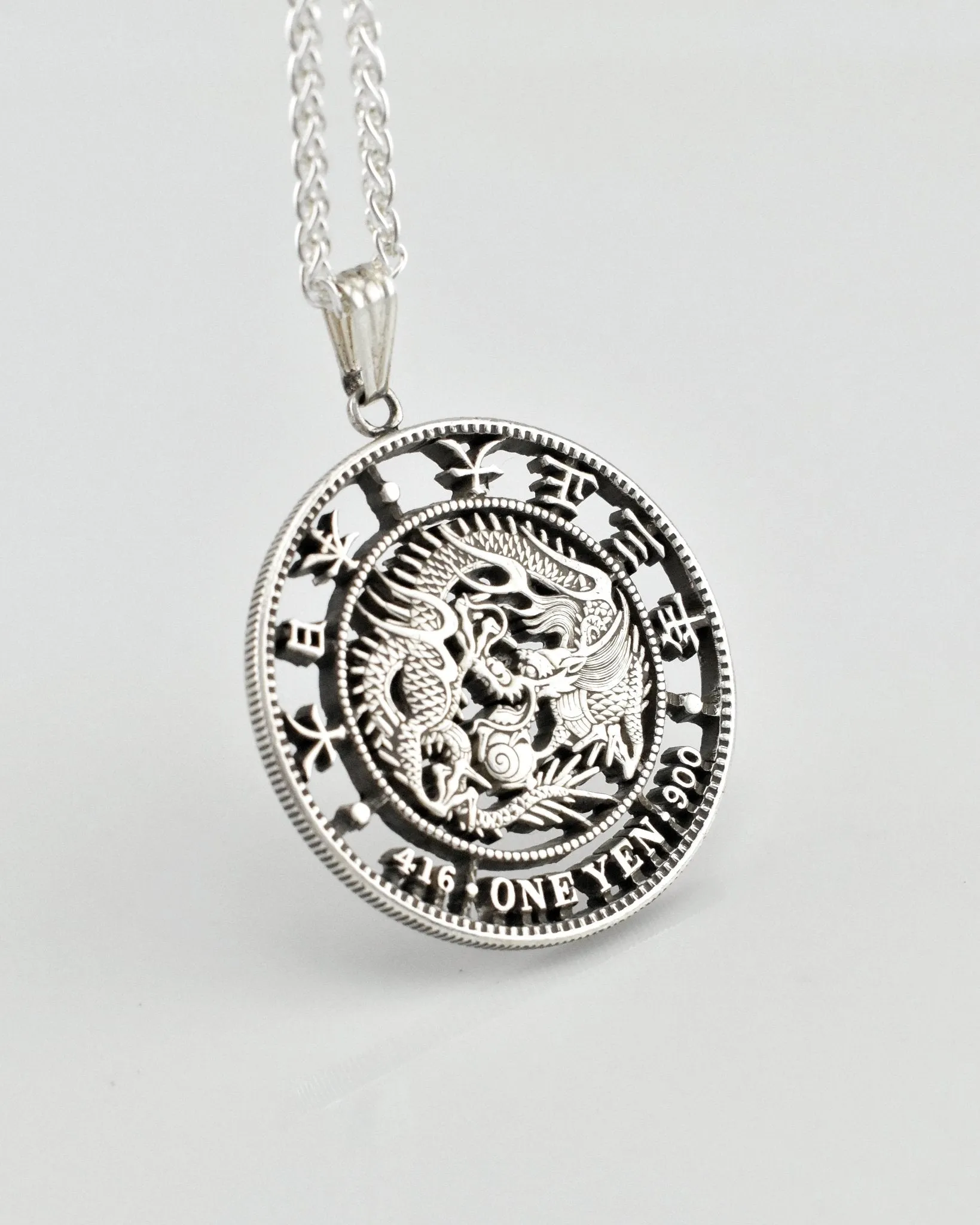 Japan - One Yen Dragon Cut Coin Pendant