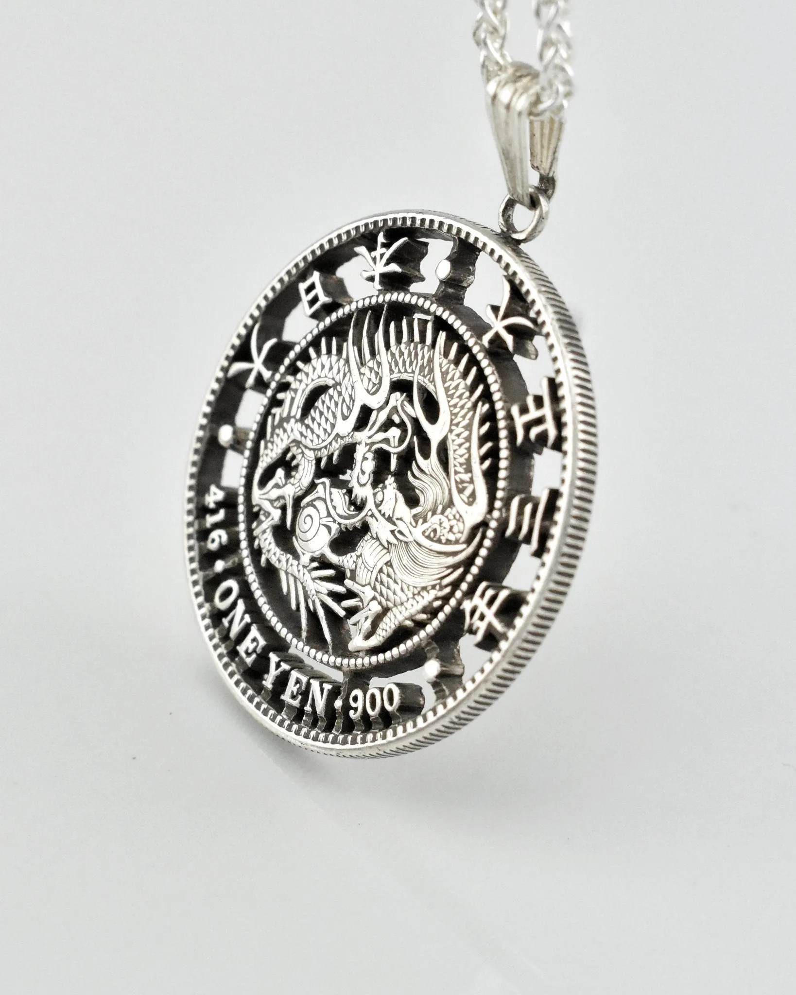 Japan - One Yen Dragon Cut Coin Pendant