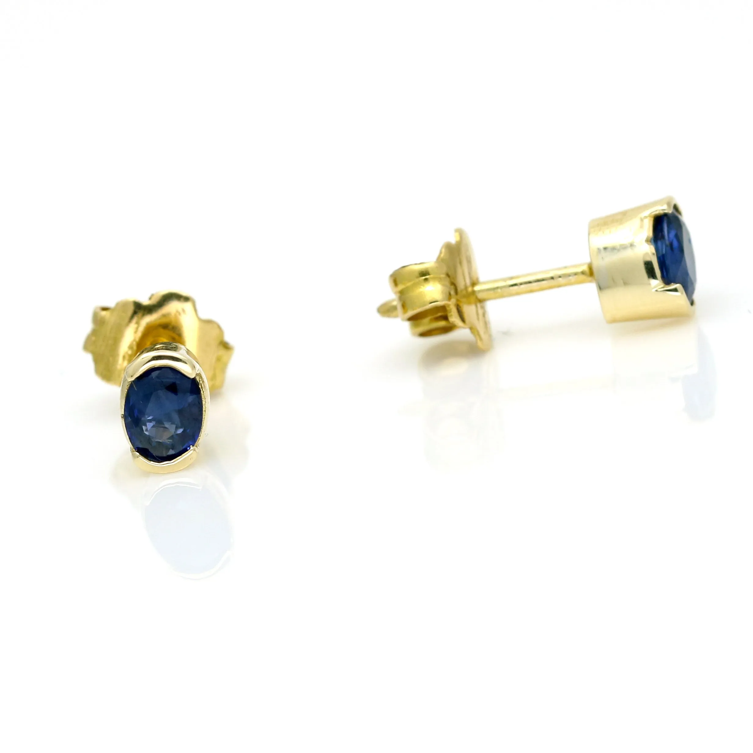 Oval Blue Sapphire Stud Earrings in 14k Yellow Gold
